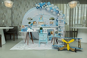 Boy`s birthday party with bluish pastel colors decoration