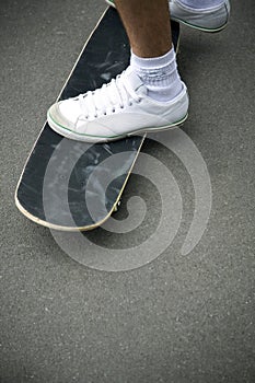 Boy& x27;s feet on skateboard. Conceptual image shot