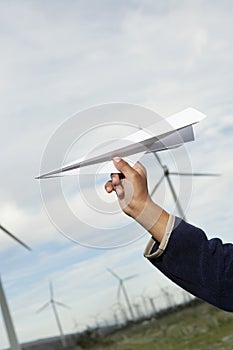 Boy's Hand Throwing Paper Plane