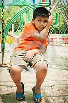 Boy sad alone at playground