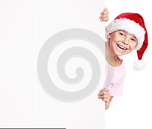 Boy in Santa hat with white blank