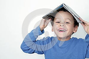 Boy with school book going back to school stock photo