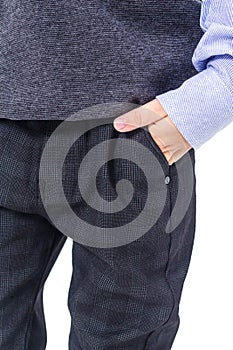 Boy in a school uniform on a white background. Checked wool trousers with pockets close-up