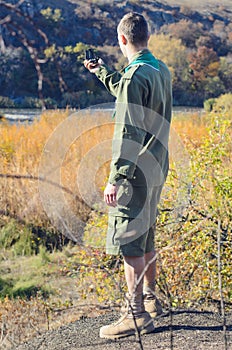 Boy Scout Holding a Compass to Find Direction