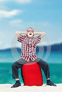 Boy screaming at the beach