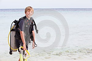 Boy With Scuba Diving Equipment Enjoying Beach Holiday