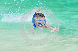 Boy in the sea water in the steamy poppy