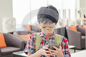 Boy searching map on smart phone