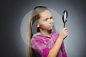 Boy See Through Magnifying Glass, Kid Eye Looking with Magnifier Lens over Gray