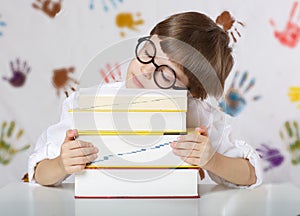 Boy of seven years old with books. Back to school