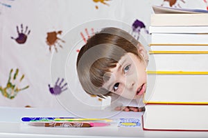 Boy of seven years old with books. Back to school