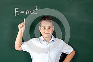 Boy in a shirt with school boards