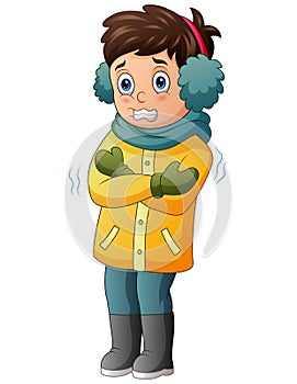 A boy shivering in winter weather