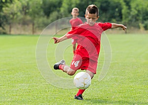 Boy Shooting at Goal