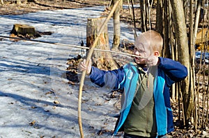 Boy shoots a bow