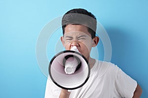 Boy shouting with megaphone
