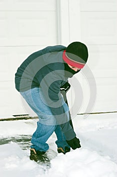 Boy Shoveling Snow