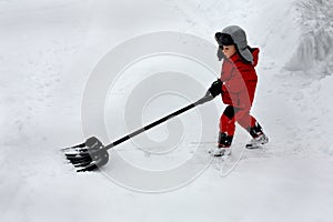 Boy shoveling snow