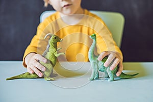 Boy showing a dinosaur as a paleontologist