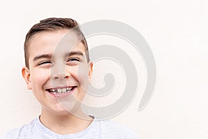 boy showing his lost milk tooth, close up