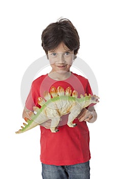 Boy is showing his toy dinosaur