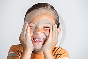 Boy showing missing teeth.