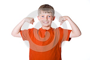 The boy shows his muscles