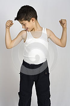 Boy shows his muscles