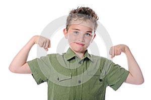 The boy shows his muscles