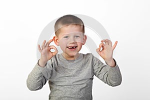 Boy shows okey sign