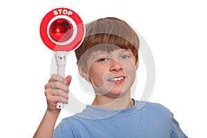 Boy shows stop sign