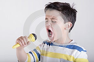 Boy singing to microphone