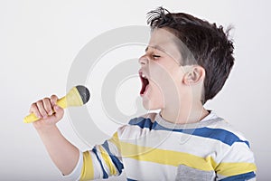 Boy singing to microphone