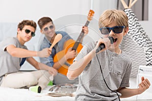 Boy singing to microphone