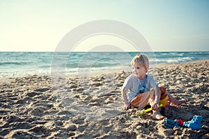 Boy sitting on a beach