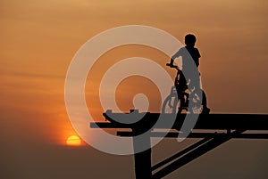 A boy sitting on bicycle 2