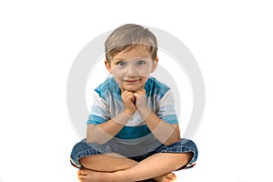 Boy sitting cross-legged