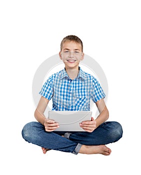 Boy sitting with digital tablet