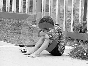 Boy Sitting Disappointed photo