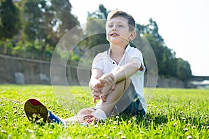 Boy sitting grass