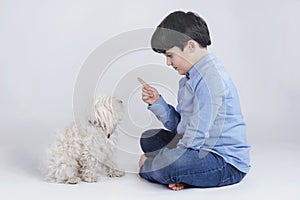 Boy sitting with his dog