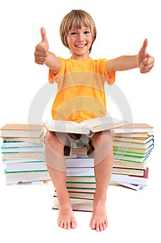 Boy sitting on piles of books