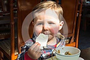 Boy sitting in a restaurant.