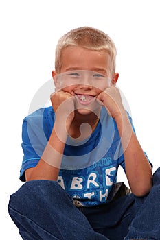 Boy Sitting and Smiling