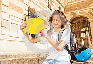 Boy sitting on the steps with empty speech bubble