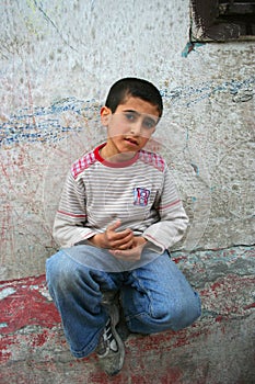 Boy sitting on the wall