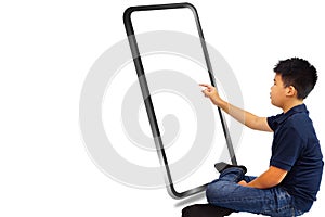 The boy sitting on white background and touch big mobile phone screen.