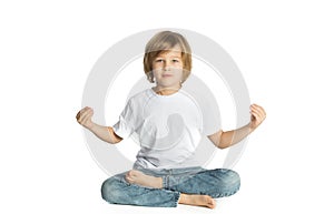 Boy sitting. Yoga. Lotus Position.