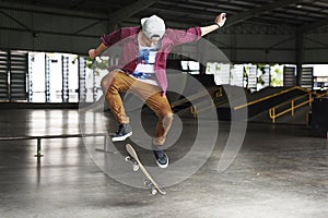 Boy Skateboarding Jump Lifestyle Hipster Concept