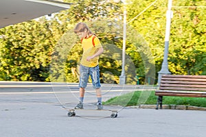 Boy skateboarding on natural background